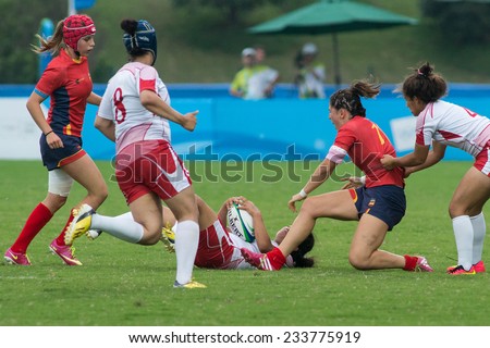 NANJING, CHINA-AUGUST 19: Spain Rugby Team (red-blue) plays against Tunisia Rugby Team (red) during Day 3 match of 2014 Youth Olympic Games on August 19, 2014 in Nanjing, China.
