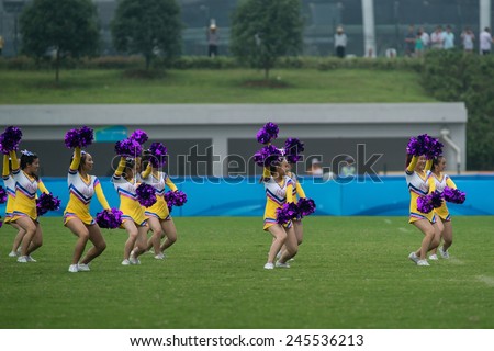 NANJING, CHINA-AUGUST 19: 2014 Summer Youth Olympic Games cheerleaders perform at half-time of Day 3 match of 2014 Youth Olympic Games on August 19, 2014 in Nanjing, China.
