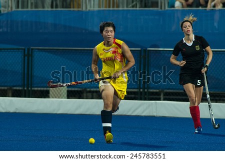 NANJING, CHINA-AUGUST 21: China Hockey Team (yellow) plays against Germany Hockey Team (black) during Day 5 match of 2014 Youth Olympic Games on August 21, 2014 in Nanjing, China.
