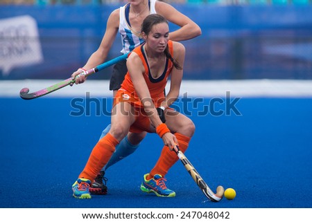 NANJING, CHINA-AUGUST 20: Holland Hockey Team (orange) plays against Argentina Hockey Team (white-blue) during Day 4 match of 2014 Youth Olympic Games on August 20, 2014 in Nanjing, China.