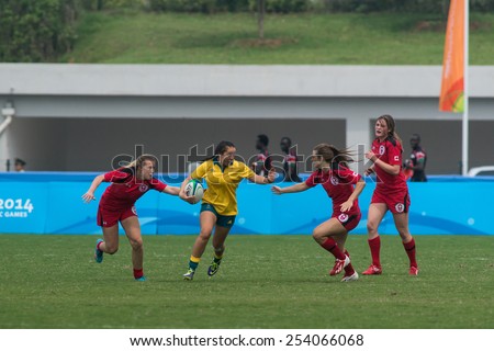 NANJING, CHINA-AUGUST 20: Australia Rugby Team (yellow) plays against Canada Rugby Team (red) during final match of 2014 Youth Olympic Games on August 20, 2014 in Nanjing, China. Australia wins 38-10.