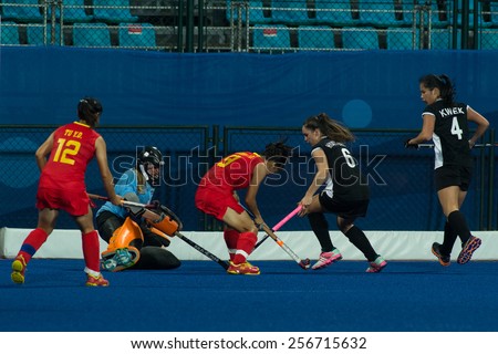 NANJING, CHINA-AUGUST 20: New Zealand Hockey Team (black) plays against China Hockey Team (red) during Day 4 match of 2014 Youth Olympic Games on August 20, 2014 in Nanjing, China. China wins 8-3.
