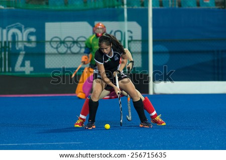 NANJING, CHINA-AUGUST 20: New Zealand Hockey Team (black) plays against China Hockey Team (red) during Day 4 match of 2014 Youth Olympic Games on August 20, 2014 in Nanjing, China. China wins 8-3.