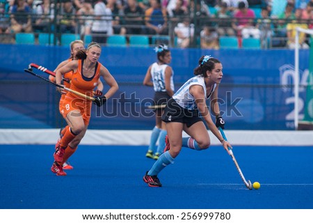 NANJING, CHINA-AUGUST 20: Argentina Hockey Team (white-blue) plays against Holland Hockey Team (orange) during Day 4 match of 2014 Youth Olympic Games on August 20, 2014 in Nanjing, China.