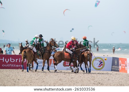 HUA HIN, THAILAND - APRIL 19: Hong Kong Polo Team (white-red) plays against Macau Polo Team (white-green) during 2014 Beach Polo Asia Championship on April 19 2014 in Hua Hin, Thailand.