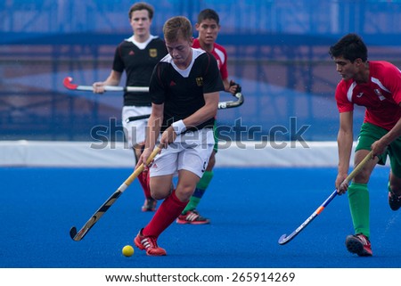 NANJING, CHINA-AUGUST 21: Germany Hockey Team (black) plays against Mexico Hockey Team (red) during Day 5 match of 2014 Youth Olympic Games on August 21, 2014 in Nanjing, China.