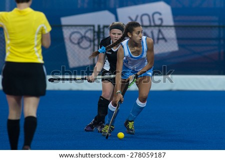 NANJING, CHINA-AUGUST 21: Uruguay Team (blue-white) plays against New Zealand Team (black) on Day 5 match of 2014 Youth Olympic Games on August 21, 2014 in Nanjing, China. Uruguay wins 6-3.