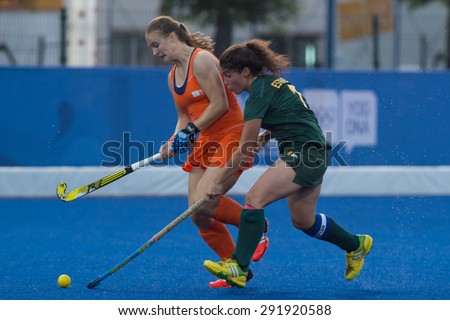 NANJING, CHINA-AUGUST 21: Netherlands Hockey Team (orange) plays against South Africa Hockey Team (green) on Day 5 match of 2014 Youth Olympic Games on August 21, 2014 in Nanjing, China.