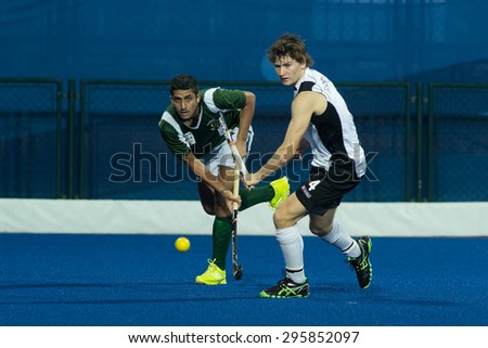 NANJING, CHINA-AUGUST 21: Pakistan Hockey Team (Green) plays against New Zealand Hockey Team (white) during Day 5 match of 2014 Youth Olympic Games on August 21, 2014 in Nanjing, China.