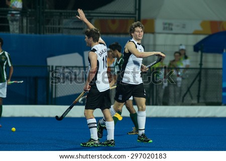 NANJING, CHINA-AUGUST 21: David Brydon of New Zealand Team (R) celebrates a goal during Day 5 match against Pakistan at 2014 Youth Olympic Games on August 21 2014 in Nanjing, China.