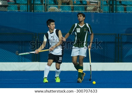 NANJING, CHINA-AUGUST 21: New Zealand Hockey Team (white) plays against Pakistan Hockey Team (green) on Day 5 match of 2014 Youth Olympic Games on August 21, 2014 in Nanjing, China.
