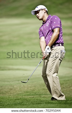 HUA HIN THAILAND - DECEMBER 19: Filipino golfer Angelo Que in action during the final day of Black Mountain Masters 2010 on December 19, 2010 at Black Mountain Golf Club in Hua Hin Thailand