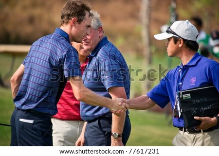 HUA HIN THAILAND - JANUARY 7: Rhys Davies of Wales shakes hand with staff during day 1 of The Royal Trophy tournament Europe VS Asia on January 7, 2011 at Black Mountain Golf Club in Hua Hin Thailand