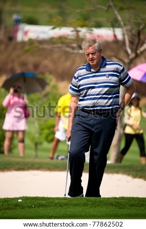 HUA HIN, THAILAND - JANUARY 8: Scottish golfer Colin Montgomerie thinks of his next move on Day 2 of The Royal Trophy, Europe VS Asia at Black Mountain Golf Club on January 8, 2011 in Hua Hin, Thailand