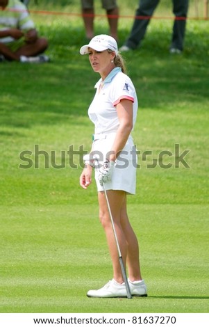 PATTAYA THAILAND - FEBRUARY 19: US golfer Cristie Kerr reacts after a shipping a ball on Day 3 of Honda LPGA Thailand 2011 on February 19, 2011 at Siam Country Club Old Course in Pattaya, Thailand