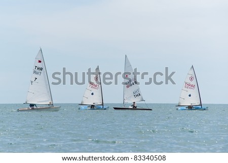 CHA-AM THAILAND - AUGUST 23: Group of unidentified sailors from Thailand compete on Day 2 of the 2011 Hua Hin Regatta on August 23, 2011 at Dusit Thani Resort & Spa Hua Hin in Cha-Am, Thailand
