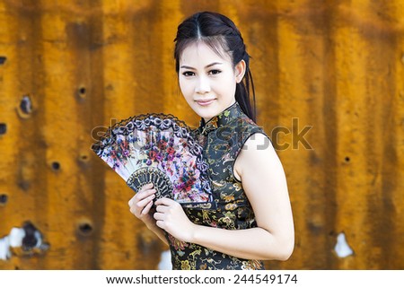 China Girl,Chinese woman black dress traditional cheongsam ,close up portrait