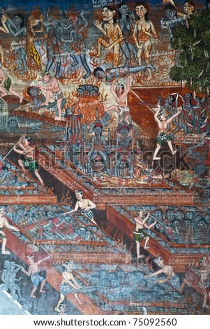 Ancient Buddhist temple mural depicting a Thai daily life scene at Wat Thalo, a famous temple in Phichit province, Thailand. The temple is open to the public and has beautiful murals on the walls.