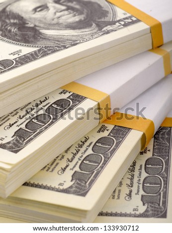 The close up stack of dollars on a background