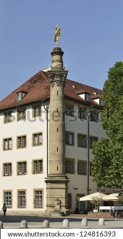Mercury column, Stuttgart,  view of historical column in city center with golden statue on its top, shot in bright summer light
