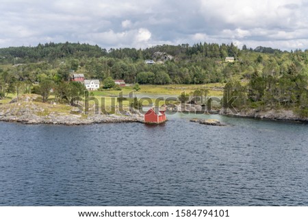 fjord landscape with spaced out houses on green fjord shore, shot under bright summer light at Karbo, Norway Zdjęcia stock © 