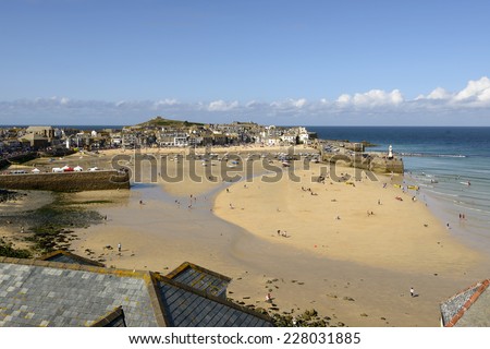 St. IVES, UNITED KINGDOM - AUGUST 17 people walk in the dry harbor at week end, shot on 2014 august 17, St. Ives , Cornwall, United Kingdom