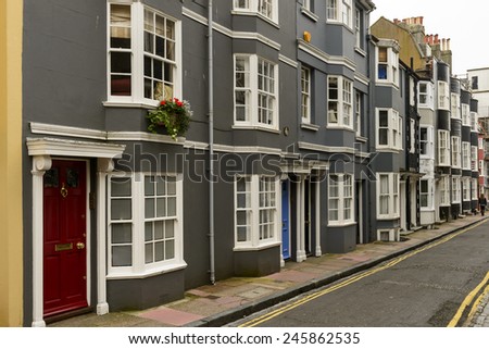 old street at Brighton, foreshortening of facades of old houses on a street in touristic sea town,  Brighton, East Sussex