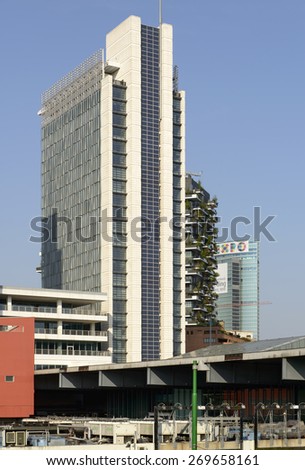 MILAN, ITALY - APRIL 11: foreshortening of tall buildings  and, in background, Regione Lombardia building with EXPO advertising at business hub in city center, shot  on april 11 2015  Milan, Italy