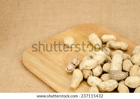 Image of roasted peanuts on brown sack background