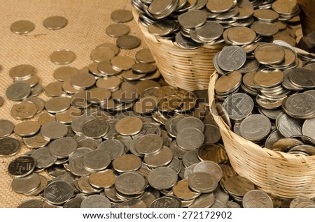 Stack of Thai baht coin on brown sack background