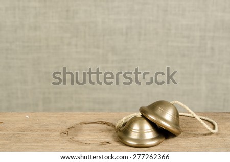 Thai small fingers cymbal on old wood