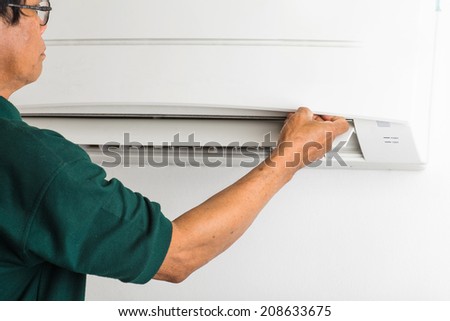 man repair air conditioner