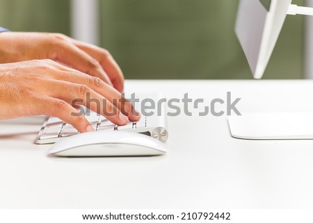 male hands typing on computer keyboard
