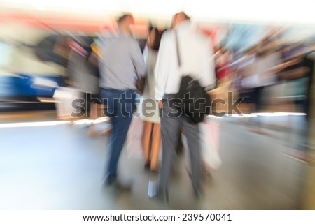 Business people walking in the city in motion blur