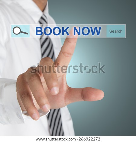 Male hand pressing BOOK NOW button