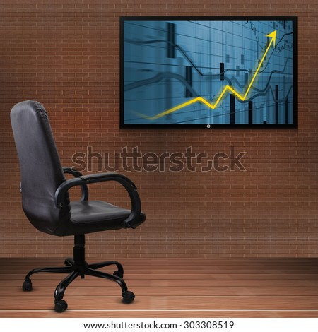 Office chair and TV screen with business graph