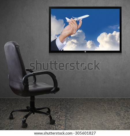 Office chair and TV screen, The concept of holiday