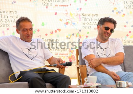 SARAJEVO - AUGUST 17: Nazif Mujic and Danis Tanovic give an interview and answer questions at the opening ceremony of the 19th Sarajevo Film Festival on August 17, 2013 in Sarajevo.