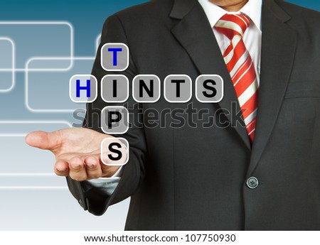 Businessman hand with text Tips and Hints