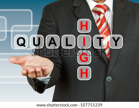 Businessman hand with text High Quality