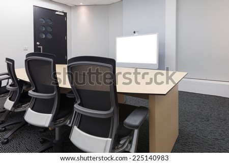 Empty video conference room with white screen focus at camera