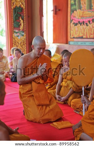 LOPBURI - NOVEMBER 19. Newly ordained Buddhist monk has a ritual in the temple procession in Thailand on November 19, 2011 in Lopburi. Monk ordinations in Thailand are very important social events.