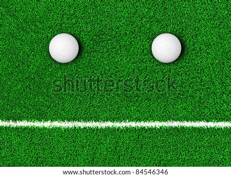 Fake grass and golf ball as human face