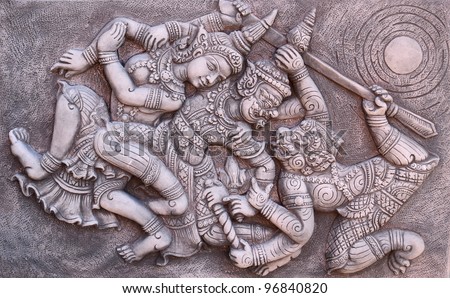 Ramayana bas-relief sculpture of Tosakan (ten face) giant , Thailand