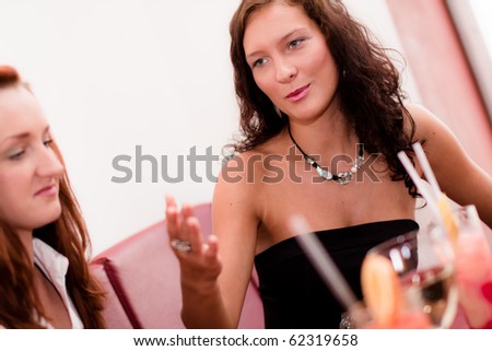 Nice dark-hair women listening to the other woman