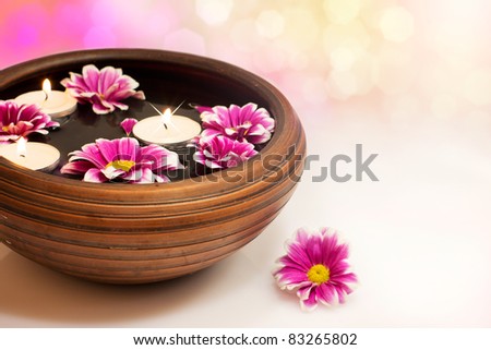 candles with flower in water,close-up
