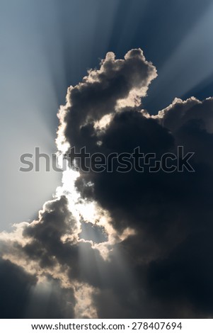 Clouds close up in sky before rain with sun ray