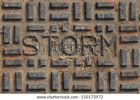 Storm sewer cover aptly stamped with the word storm