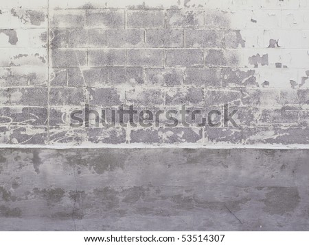 Old warehouse cinder block exterior with peeling paint