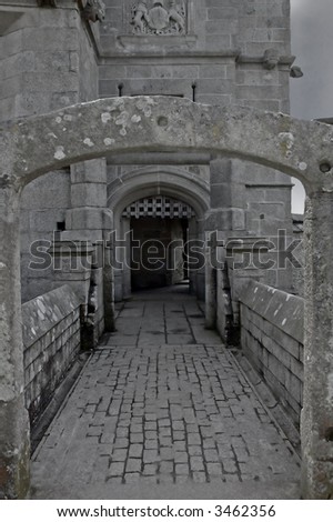 Medieval castle entrance in natural grey stone